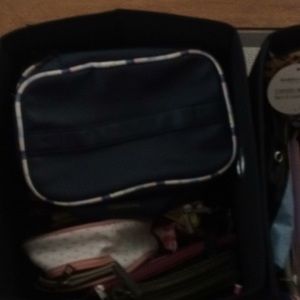 3 totes full of makeup cases and cosmetic bags
